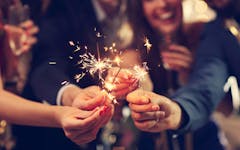 Picture showing group of friends having fun with sparklers