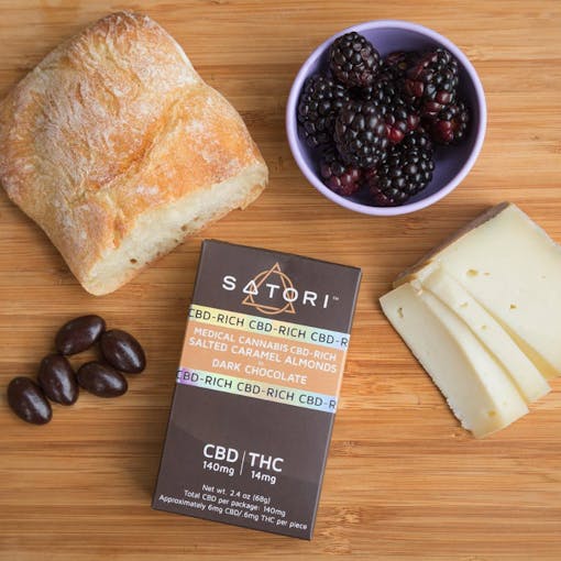Serving up bite-size morsels of CBD-rich chocolate covered caramel almonds and dried wild strawberries, Satori delivers a snack that you can munch on throughout the day to maintain a consistent, low dose of cannabinoids. | Elise McDonough for Leafly