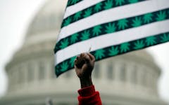 A man holds up a joint during a rally to support the legalization of marijuana on Capitol Hill, Monday, April 24, 2017 in Washington. Smoking pot in public remains illegal everywhere in Washington. (Alex Brandon/AP)