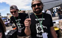 man-holding-a-joint-and-smiling