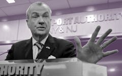 governor Murphy speaks from a podium with an outstretched hand