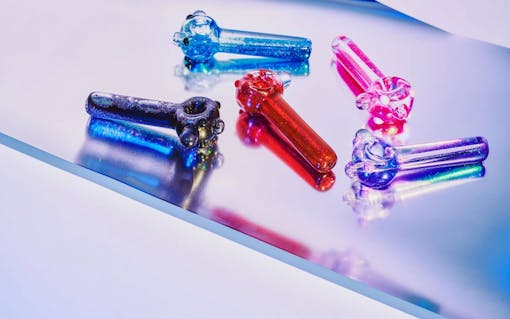 red eye glass colourful pipes