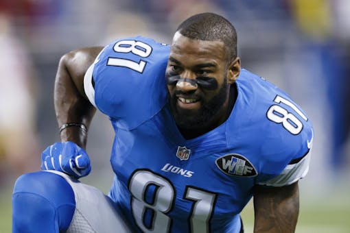 Calvin Johnson warms up before an NFL football game.