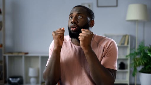 Man eagerly awaits election results from his living room
