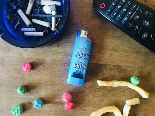 Netflix and chill lighter surrounded by munchies