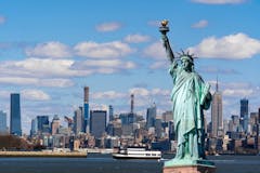 The Statue of Liberty over the Scene of New york city's lower manhattan
