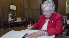 Alabama-governor-kay-ivey-signing-bill