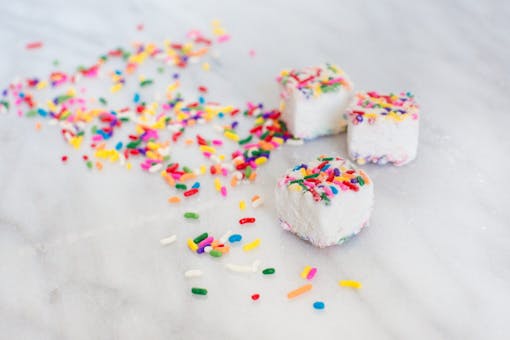A photo of Mellows cakes all white with multicolored sprinkles. (Courtesy Mellows)