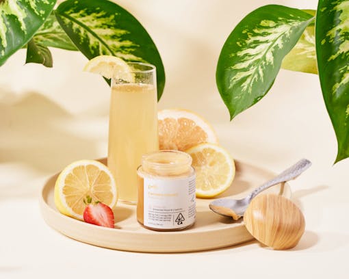 A lifestyle photo of Potli honey with lemonade on a tray. (Courtesy Potli)