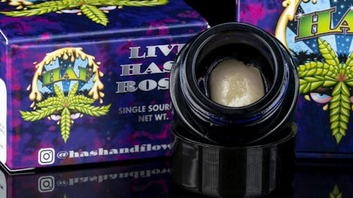 A picture of a light rosin ball in a dark jar on a black baground. Pre-legalization brand Hash and Flowers returns to legal dispensary shelves with gorgeous, terpy, single-source, vertically integrated Strawberry Guava live rosin. (Courtesy Hash and Flowers)