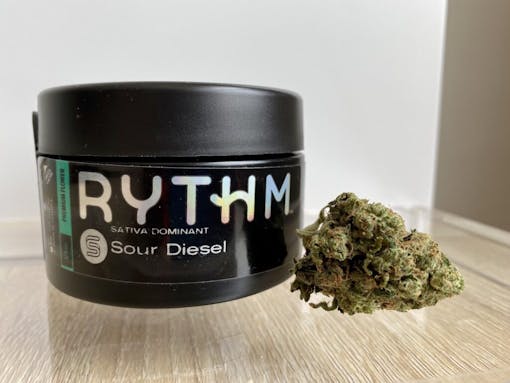 Rythm Sour Diesel nug next to packaging