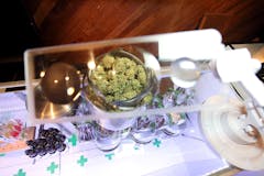 view of glass counter with weed under magnifying glass