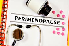 Perimenopause-the inscription of the text on the form in the medical folder. Diagnosis by a doctor, medical treatment.