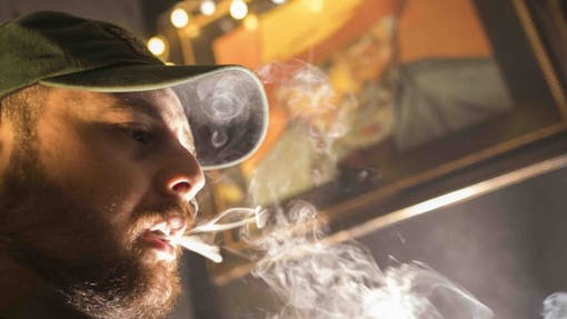 A New Yorker enjoys some local product at a Spleef NYC canna-cocktail party. (AP Photo / Mary Altaffer, File)