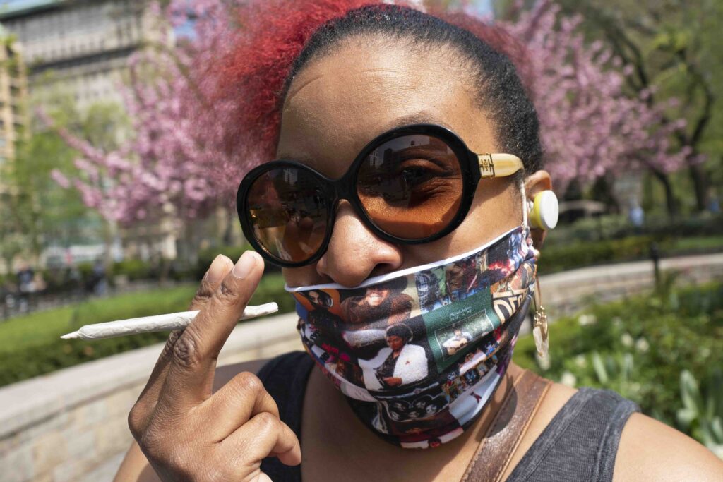 photo-of-a-woman-holding-a-joint-in-a-New-York-City-park