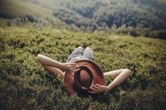 laying in a field, set and setting