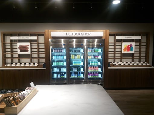 interior of pot shop including beverage cases and an edibles table