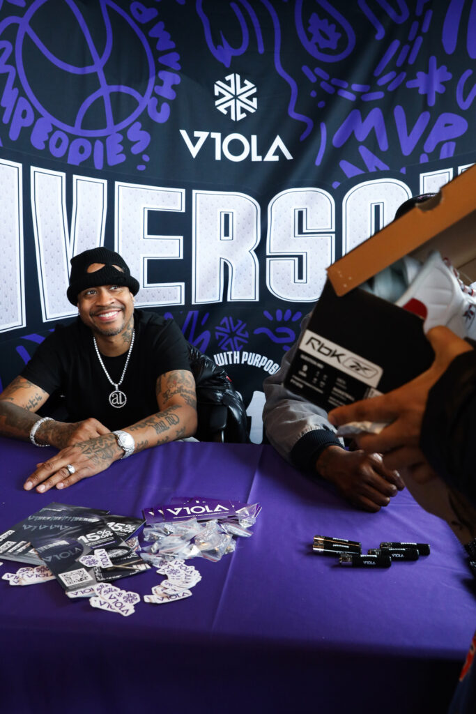 Allen Iverson smiles at a fan