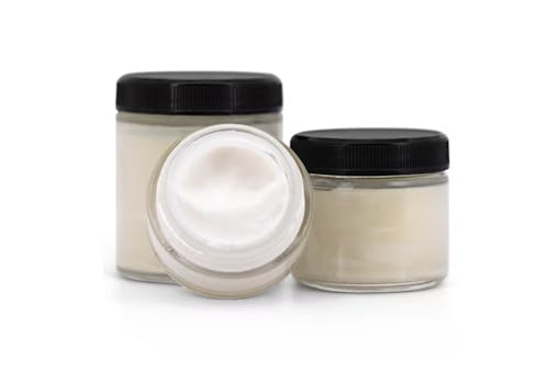 two small jars of beige cream