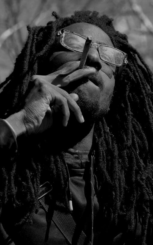 A man smokes a joint in Washington Square Park, New York City.