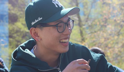 A woman laughs while using cannabis in New York City on 420.