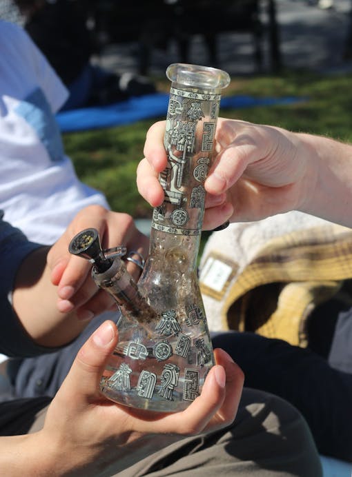New Yorkers take a bong rip in Washington Square Park.