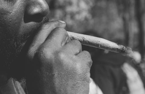 A man pulls from a jumbo joint in New York's Washington Square Park.