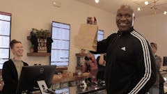 Former NFL player Marvin Washington buys first adult-use cannabis sold by The Botanist in Williamstown, NJ.
