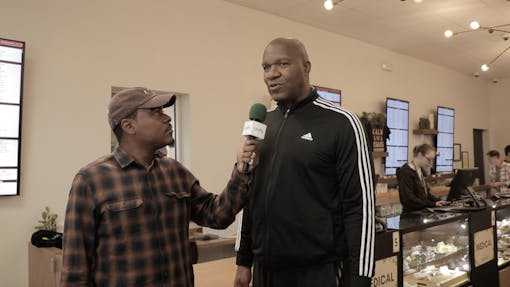 Former NFL player and Last Prisoner Project Marvin Washington ambassador talks to Leafly after buying the first legal weed sold by The Botanist in Williamstown, NJ. (Jon Bain)