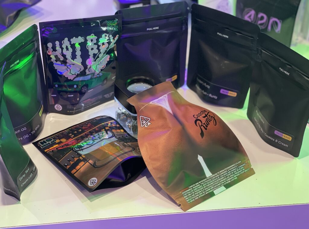 a display of packaged 8ths, including one shaped like, and depicting, a woman's legs and buttocks