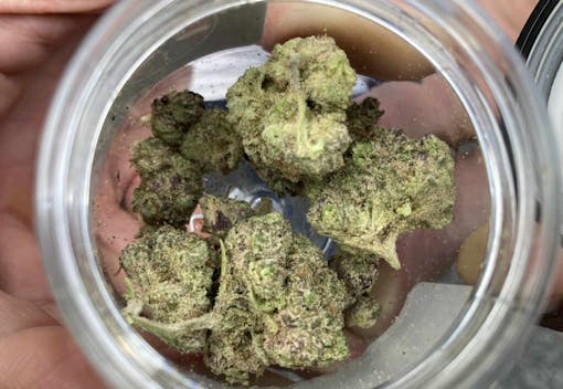 frosted weed nugs seen from above in glass jar