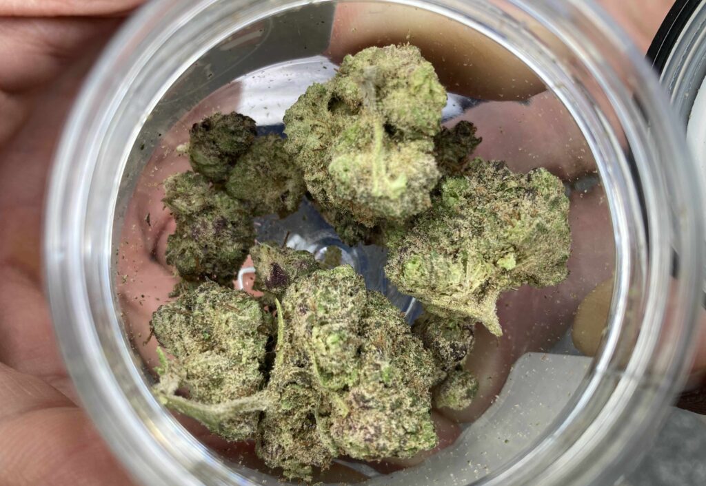 frosted weed nuggets seen from above in glass jar
