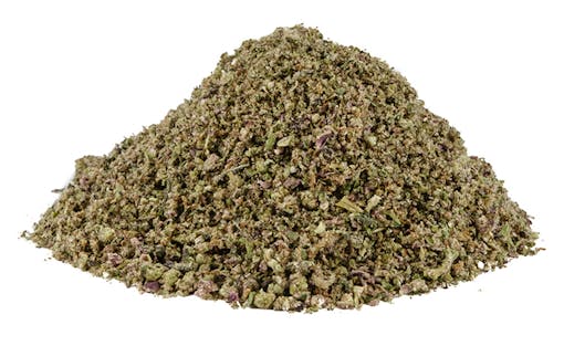 a big pile of dark green ground bud against a white backdrop