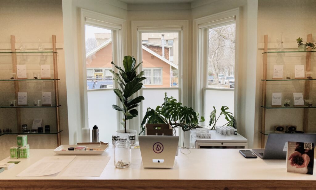 Shop counter with bay windows and shelves behind