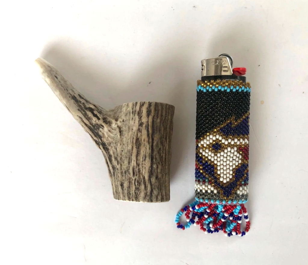 Photo of antler whistle and lighter