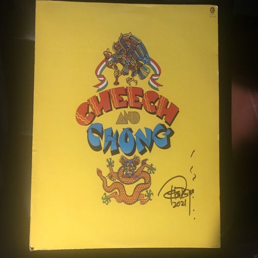 A Cheech and Chong yellow record sleeve with dragon and eagle, signed by Tommy