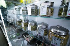 weed jars on dispensary shelf