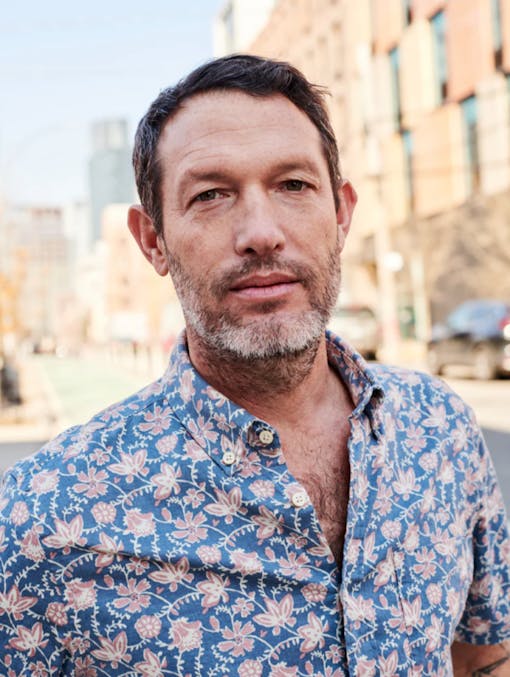 White man in a patterned shirt