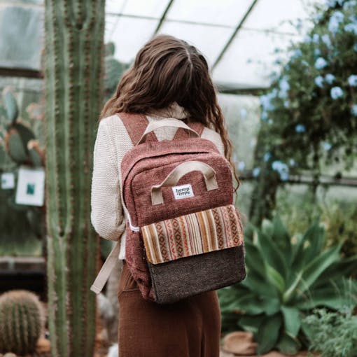 a hemp backpack and young woman facing away