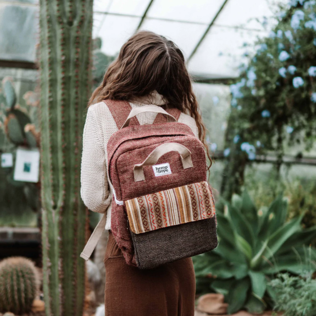 a hemp backpack and an averted young woman