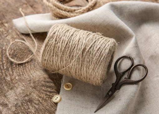 hemp twine and rope on wooden background