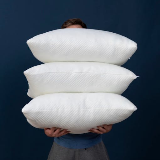 man holding pillows infused with CBD