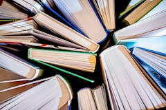 textured background from open books - close up - selective focus