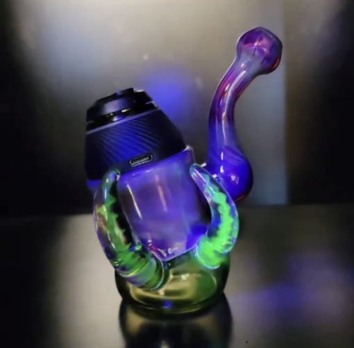 Mindblowing Glass's Puffco Proxy bottom glows in UV light. (Courtesy Mindblowing Glass)