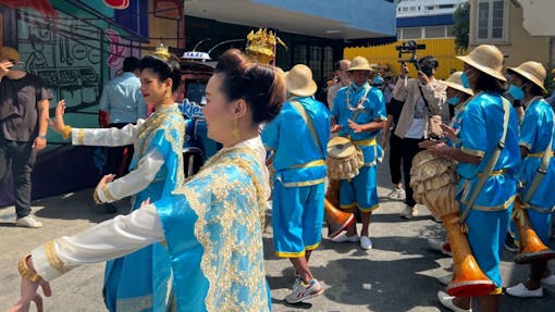 Traditional Thai dancers entertain customers on day one of sales in Bangkok. (Mikhail Harrison / Leafly)