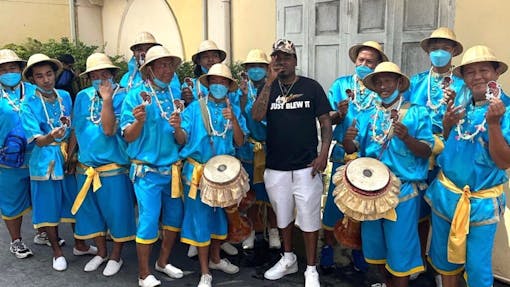 Leafly contributor Mikhail Harrison poses with Thai performers at the Cookies Thailand store in Bangkok. (Marlon Capital)