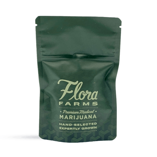 Photo of green Flora Farms packaging bag for 3.5g of cannabis with logo. Reads: Flora Farms, premium marijuana, hand-selected, expertly grown.