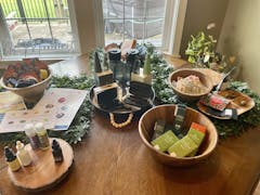 dining room table with wooden bowls full of various cannabis products