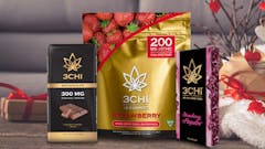 three products of products labeled '3CHI' -- a black box of chocolates, a golden package of gummies and a black vape cart box