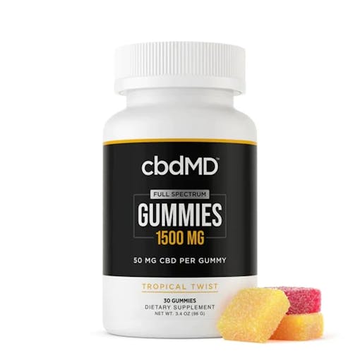 A bottle of our product pick from best cbd brand, cbdMD. Full spectrum CBD gummies are in a white and black bottle with the tropical-flavored gummies sitting next to the upfront bottle.